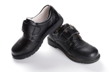 pair of brand new black leather shoe for children on white background