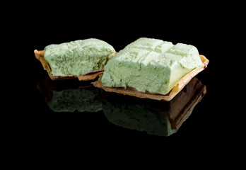 studio shoot of ice cream block on black with reflection