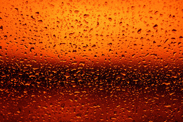 Water drops at the background of sunset