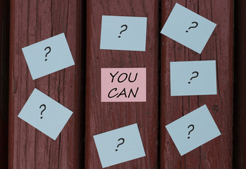 Question marks on the multicolored empty office stickers and the inscription You can, acceptance of...
