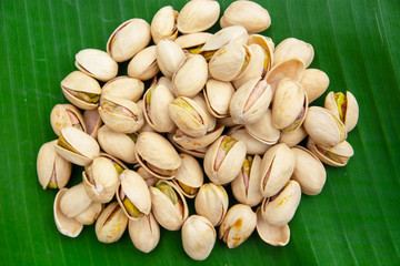 Pistachio nuts On banana leaves