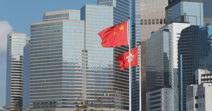 Hong Kong and China flag with business office tower