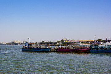 Fototapeta na wymiar View of Boats Lined up at the Harbor at Hussain Sagar Lake in Hyderabad, India