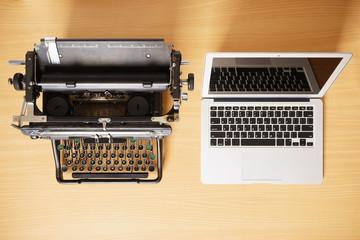 old typewriter with laptop