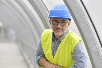 Portrait of industrial engineer with security hat and lifevest