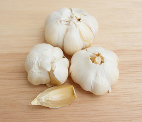 Fresh organic garlic on a wood background