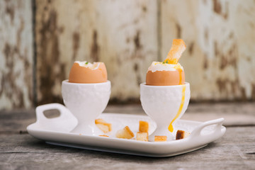 Soft boiled eggs with toast. Healthy fitness breakfast.