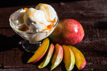 Caramel sauce ice cream and fresh mango fruit