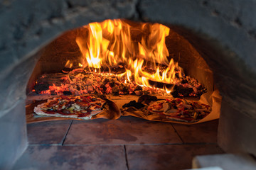 Pizza oven with flame, fire and pizzas