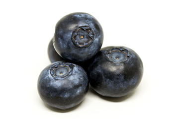 Three blueberries macro isolated on white background