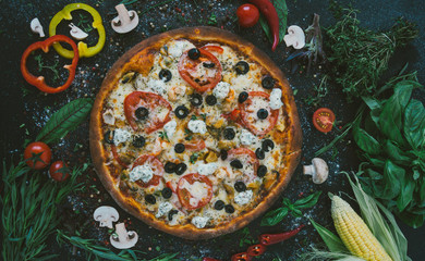 Tasty seafood pizza with cherries on a wooden table