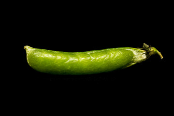Pea pod isolated over black background