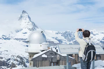 Cercles muraux Cervin Asian tourist taking photo on Mountain Matterhorn, Zermatt, Switzerland