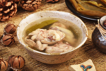 Peeled chili pepper chicken soup on the table 