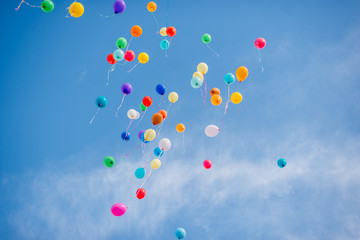 Colorful balloons on a blue sky background