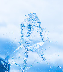 fountain of water against the blue sky