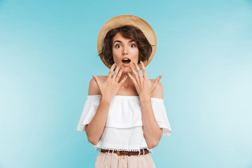 Portrait of a surprised woman with hands at her face