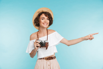 Portrait of a happy young woman in summer hat