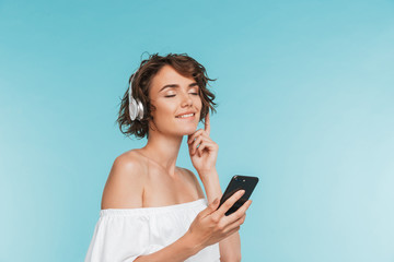 Portrait of a satisfied young woman listening to music