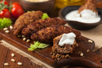 Traditional arabic kibbeh with lamb and pine nuts.