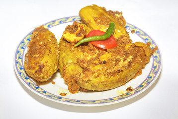 Spicy Indian food prepared with pointed gourd stuffed with fish. A traditional Bengali cuisine.