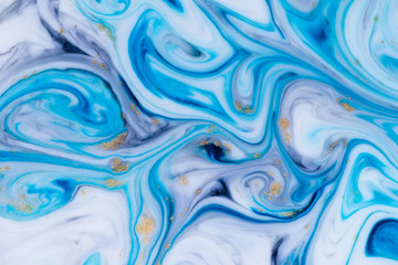 Obraz premium Marbled unique blue abstract background with gold dust. Flowing liquid marble texture.