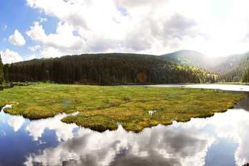 Lake Kleiner Arbersee with mount Grosser Arber in National park Bavarian forest, Germany