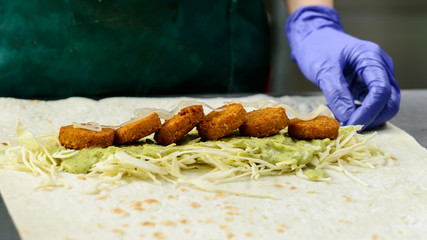 Process of preparing appetizing Falafel roll. Vegetarian food, s