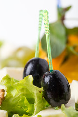 Georgian cheese platter with grapes and olives.