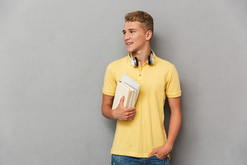 Portrait of a cheerful teenage boy with headphones