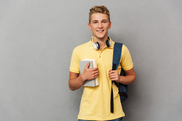 Portrait of a smiling teenage boy with headphones