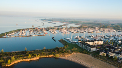 Beautiful aerial view of modern luxury yachts docked in the mari