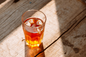 southern style iced sweet tea in two glasses rustic wooden table