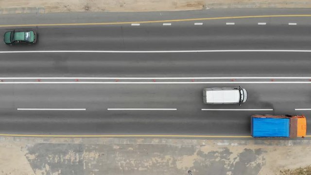 Freight and passenger cars are moving along the highway. Aerial shot. 4k.