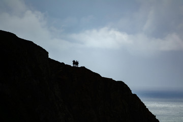 Tourists on top of cliff