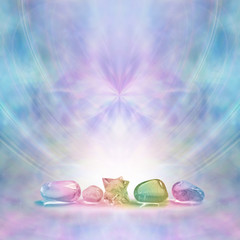 Crystal Therapy Healing Stones - Four rainbow coloured tumbled healing crystals and a merkabah in a...