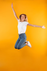Full length portrait of a cheerful young blonde girl