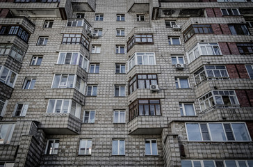 Soviet apartment building. Apartment block. Residential building. Soviet architectural style. 1980s. Grunge architecture. Ust-Kamenogorsk (Kazakhstan)