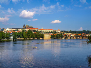 Fototapeta na wymiar Cityscape with the Vltava River, The Prague Castle and The Saint Vitus Cathedral in Prague, Czech Republic 