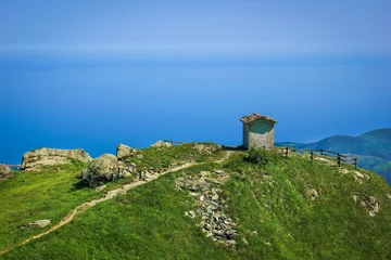 Fototapete Rund Ligurien Alpine landscape with small soldiers monument facing the Mediteranean Sea in Beigua National Geopark, Liguria, Italy  © Sebastian