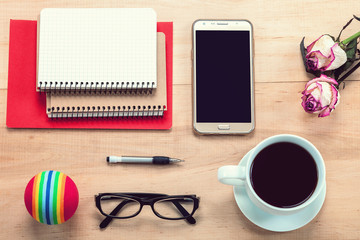 Mobile phone, glasses, cup of tea, flowers, stationery