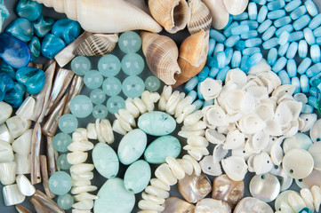 Gray plate with beads and seashells