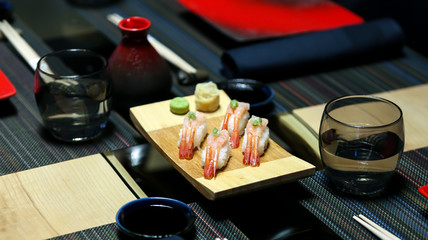 Asian food served on black stone, top view. Chinese and vietnamese cuisine set.
