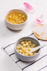 Vietnamese food, sweet lotus seed gruel, ingredients: lotus bean, sugar candy. this Vietnam dish for dessert or snack, very delicious, tasty, nutrition, make sleep well
