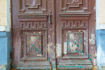 Old brown doors in the wall