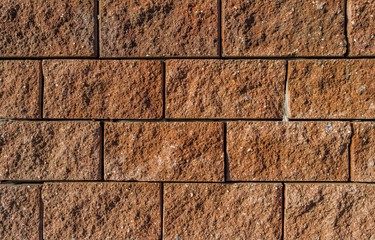 Concrete tiles background. Finishing tiles. The wall of the building. Brown. Decorative stone. Surface of the wall