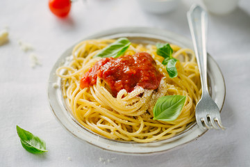 Pasta dish with tomato sauce on white plate