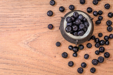 Berries of forest blueberries on a wooden table