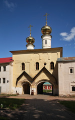 Fototapeta na wymiar Holy Gate with Church of Ascension at Tikhvin Assumption Monastery in Tikhvin. Leningrad oblast. Russia