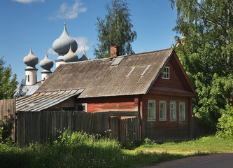 Old street and Assumption Cathedral at Tikhvin Assumption Monastery in Tikhvin. Leningrad oblast. Russia